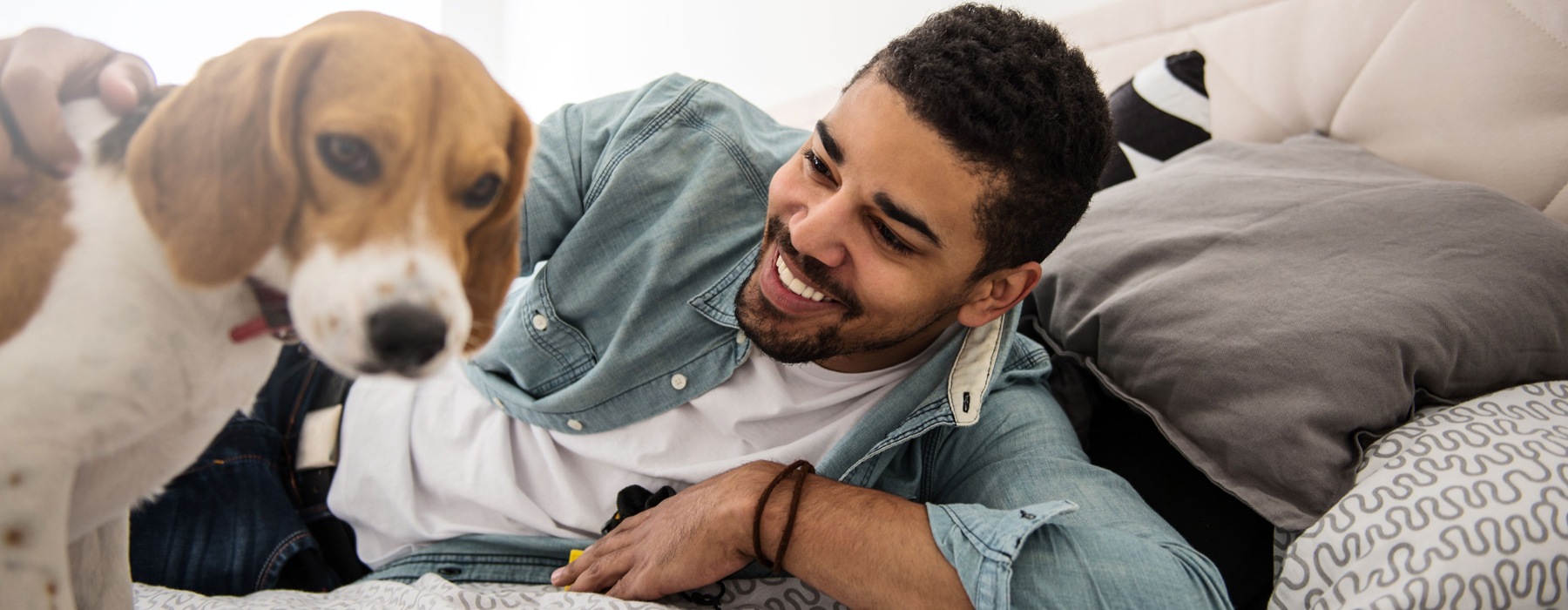 Man with his dog on the couch