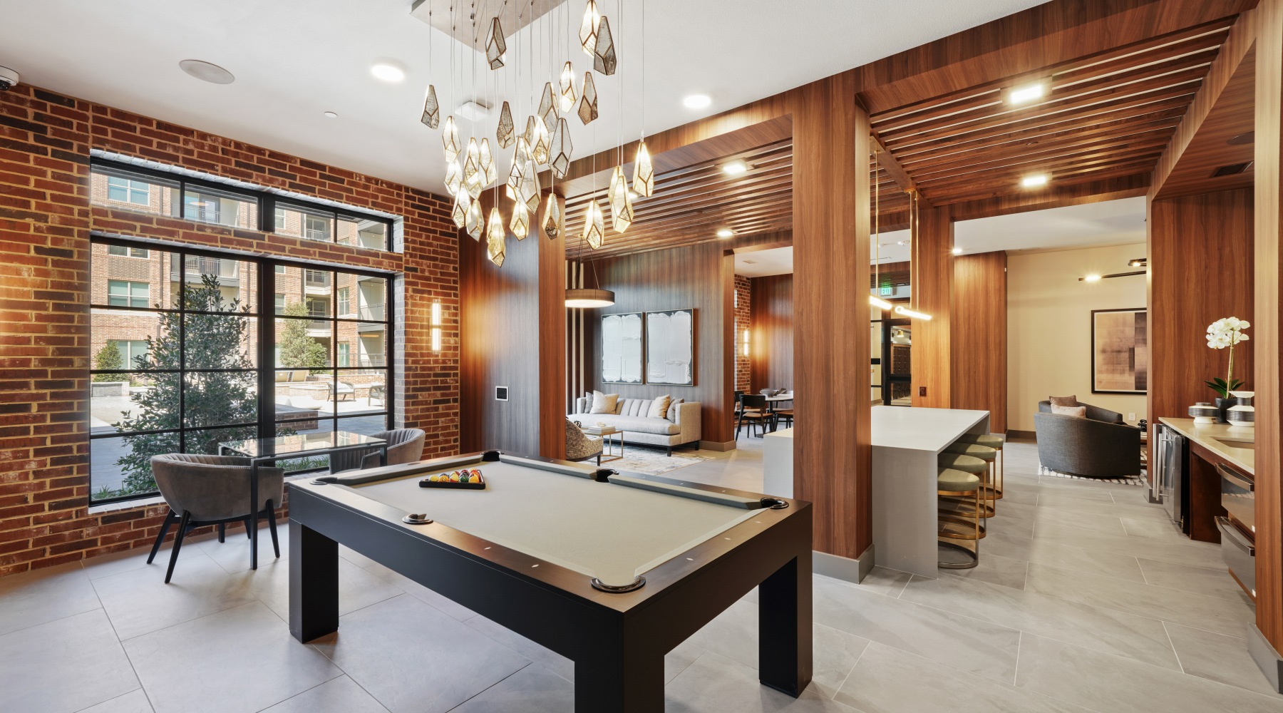 large clubhouse with pool table and bar 