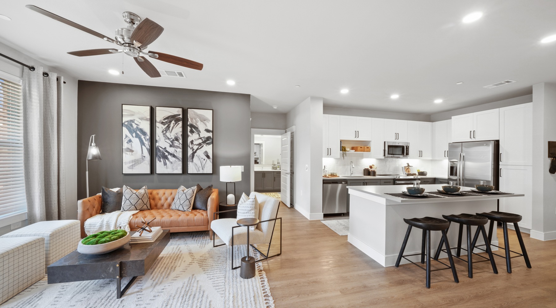 Large living room with open floor plan and hardwood flooring